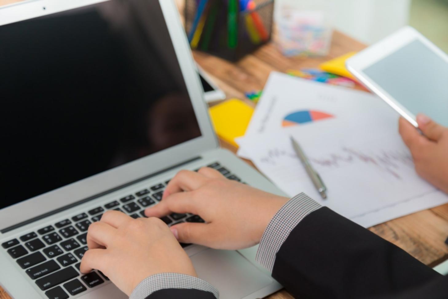 Person reviewing financial documents with confidence